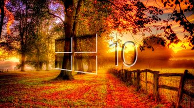 Escritorio de Windows 10 con el logo y un fondo de hojas de otoño, simbolizando el fin de su ciclo de soporte en octubre de 2025.