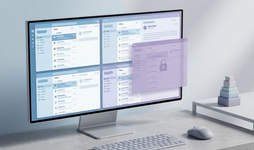 Monitor de escritorio que muestra una representación conceptual del nuevo Outlook con múltiples ventanas de bandejas de entrada y una capa flotante de seguridad.