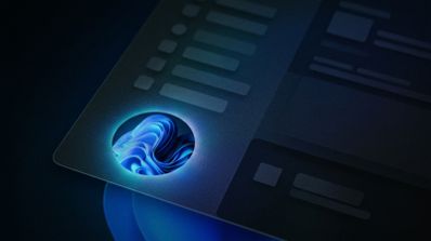 Primer plano del avatar de usuario en un menú de Windows 11 con el fondo de pantalla Bloom azul iluminado.