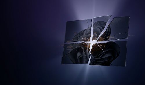 Ilustración conceptual del logotipo de Windows formado por cristales rotos y agrietados sobre un fondo oscuro.